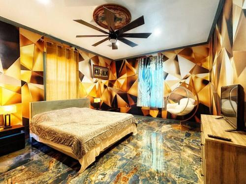 a bedroom with a bed and a ceiling fan at Luxury Palace / Vacation Home in Alvin