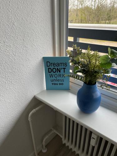 a sign that says dreams dont work unless you us on a window sill at Casa House of Bricks 2 - LEGOLAND 650m in Billund