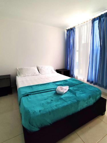 Una cama o camas en una habitación de Hermoso apartamento en Popayán