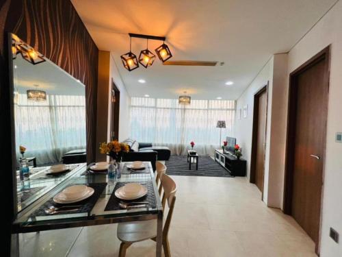 a living room with a dining table and a living room at VORTEX KLCC Apartment Kuala Lumpur Bukit Bintang in Kuala Lumpur