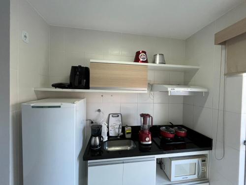 Kuchyň nebo kuchyňský kout v ubytování Flat 405 - Condomínio Veredas do Rio Quente - Diferenciado com ar na sala e no quarto