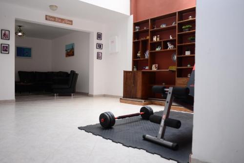 a living room with a gym equipment on a rug at Casa MoraZ Negro in Medellín