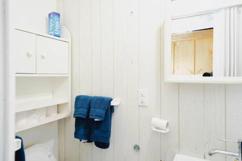 a bathroom with a sink and a blue towel at Get away from it all Rock Elm in Marion Bridge