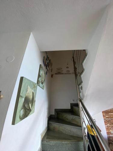 a staircase in a house with a stair case at Βεράντα στο Αιγαίο in Kókkinon Nerón