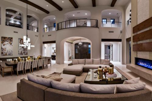 a large living room with couches and a dining room at Brown Villa in Edmonton