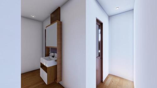 een badkamer met een wastafel en een spiegel bij adma hotel in Paje