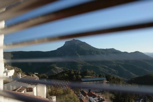 a view of a mountain from a window at Alojamientos Messía de Leiva in Segura de la Sierra