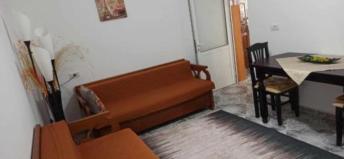 a living room with a couch and a table at Flat rent berat in Berat