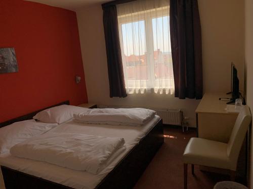 Кровать или кровати в номере City Hotel Agoston