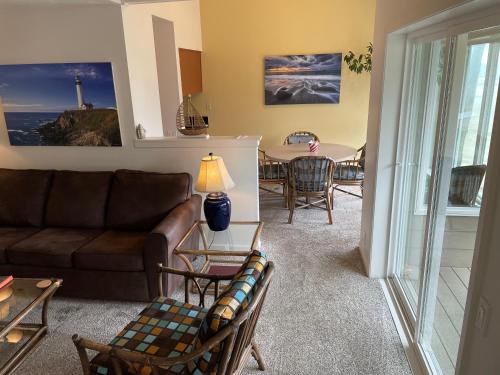 a living room with a couch and a table at Starfish Point in Newport