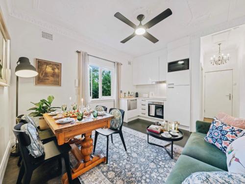a living room with a table and a couch at XQ Collection Jaques la Maison in Sydney