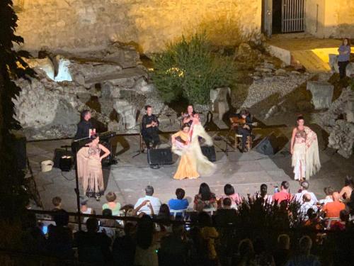 a group of people on a stage in front of a crowd at CASA MENCÍA CÓRDOBA in Doña Mencía