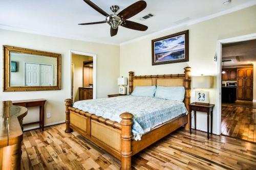 a bedroom with a bed and a ceiling fan at Siesta Key Beach Home in Siesta Key