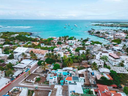 an aerial view of a city and the ocean at Maidith Galapagos Inn in Puerto Ayora