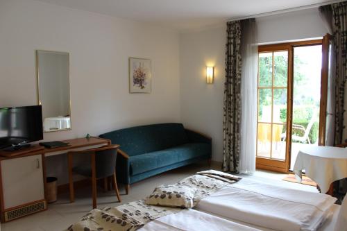 Posteľ alebo postele v izbe v ubytovaní Seehotel Paulitsch