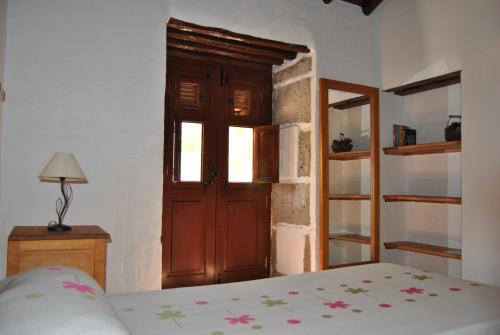Ένα ή περισσότερα κρεβάτια σε δωμάτιο στο Casa Rural La Aldaba