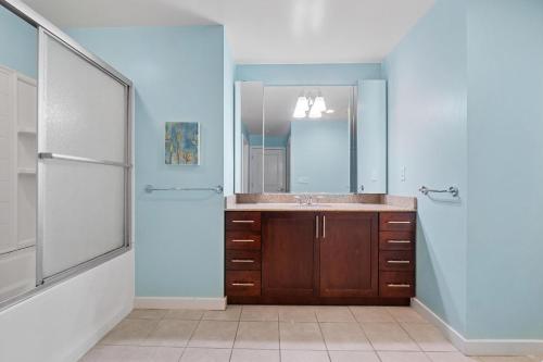 a bathroom with a sink and a mirror at Island Breeze 120A in Virginia Beach