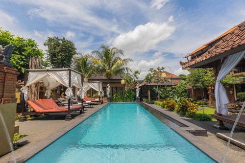 an image of a swimming pool at a villa at Pondok Kutuh Guest House in Ubud