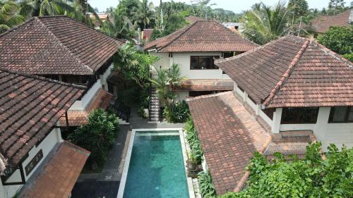 an aerial view of a house with a swimming pool at Kanma Resort in Ubud