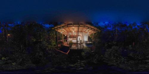 an overhead view of a tree house at night at Puyu Glamping in Tarqui