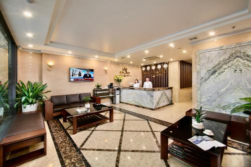 a lobby of a hotel with a reception desk at Marina Hotel Ha Noi in Hanoi