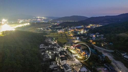 a city lit up at night with lights at Gyeongju Art in my diary Pension in Gyeongju