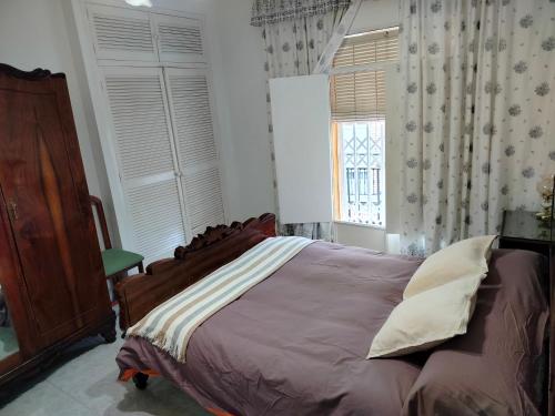 Postel nebo postele na pokoji v ubytování Casco Antiguo