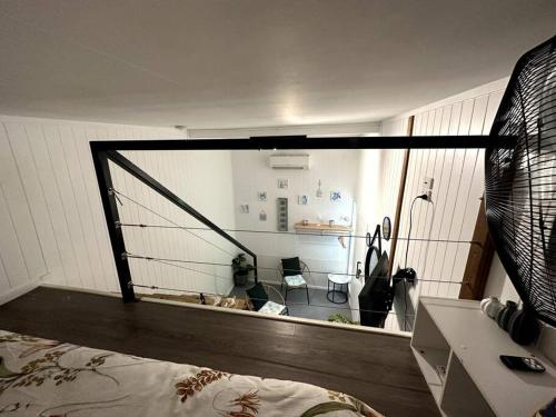 a room with a view of a room with a mirror at NEW! Sea Joley Tiny Home in Nelly Bay