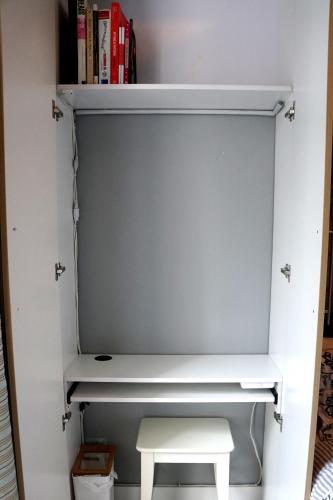 a shelf in a closet with a stool in it at McKinley Hills BGC Taguig City Condo in Manila