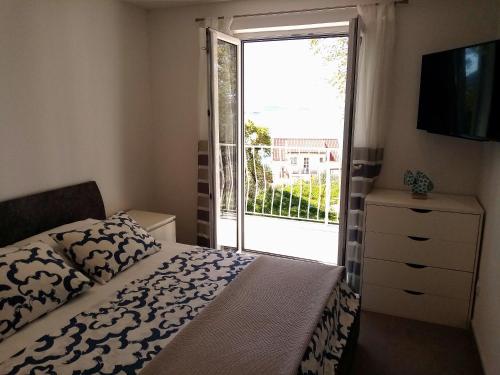 Posteľ alebo postele v izbe v ubytovaní Studio apartman Iva