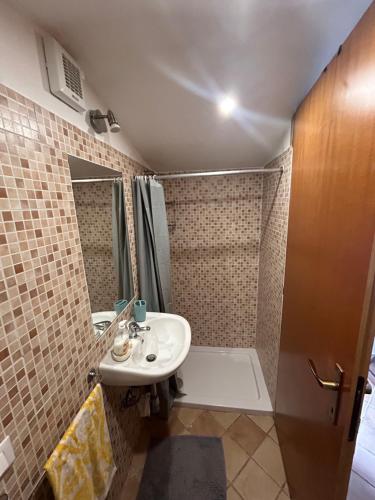 a bathroom with a sink and a shower at Casa Dolly in Cagliari