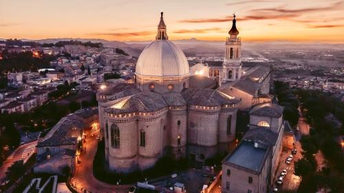 an aerial view of a cathedral in a city at sunset at Casina al mare in Porto Recanati