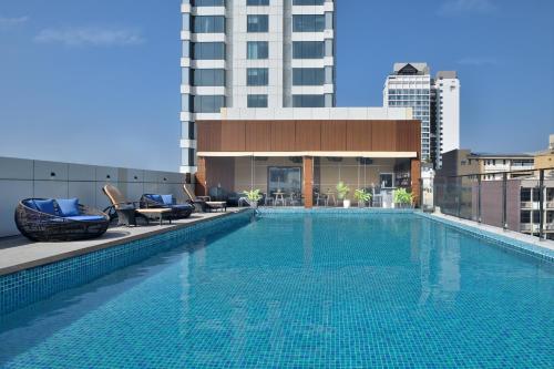 a large swimming pool on top of a building at Sheraton Colombo Hotel in Colombo