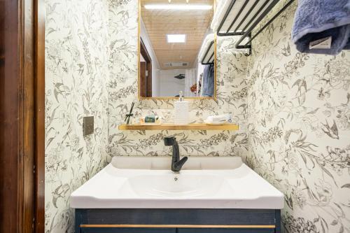 a bathroom with a sink and a mirror at Shanghai Riverview Vacation Villa in Shanghai