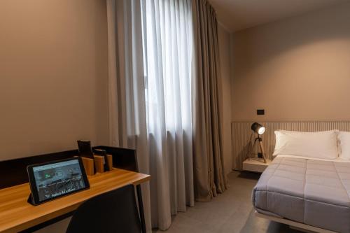 Ένα ή περισσότερα κρεβάτια σε δωμάτιο στο Amare Suite & Apartments