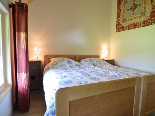 Llit o llits en una habitació de Quaint Farmhouse in Geesteren with Meadow View