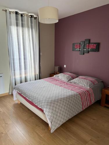 a bedroom with a bed and a large window at AppartHotel ST MICHEL in Brest