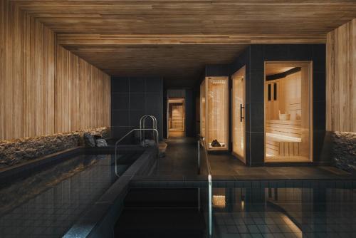 a bathroom with a plunge pool in a house at Six Senses Kyoto in Kyoto