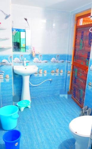 a bathroom with a sink and a shower at Atithi home stay and Cloud Kitchen in Ayodhya