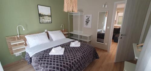 Ένα ή περισσότερα κρεβάτια σε δωμάτιο στο AIRNEST Comfort residence