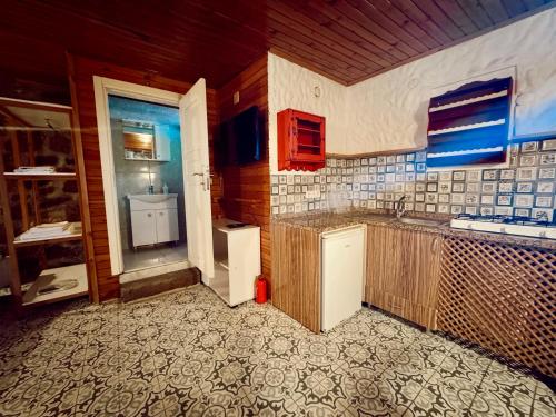 a kitchen with a sink and a counter top at Cagla Hotel in Ildır