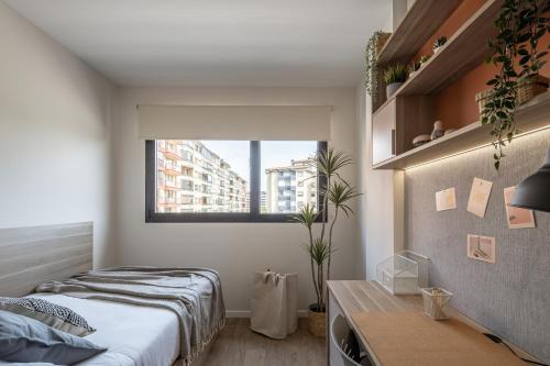 Postel nebo postele na pokoji v ubytování AMRO PAMPLONA Residencia de estudiantes