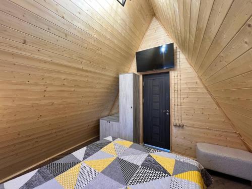a room with a bed and a tv on the wall at Cherry House Ohanavan by Amaranoc am in Oganavan