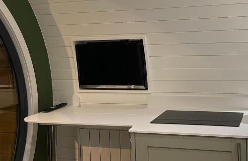 a flat screen tv sitting on top of a counter at Luxury Glamping In North Yorkshire National Park & Coastal Area in Scarborough