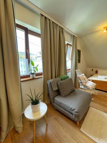 a living room with a couch and a table at Guest house Ivica i Marica in heart of the national park Plitvička jezera in Plitvica selo