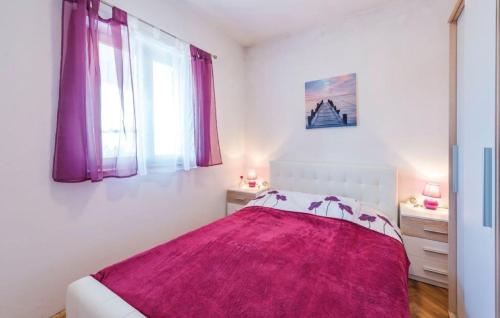 a white bedroom with a bed with a pink blanket at Holiday house in rural Istria with pool and hydromassage in Žminj