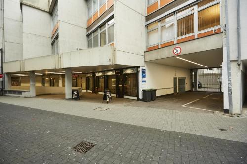 an empty street in front of a building at Harbour Apartments in Karlsruhe
