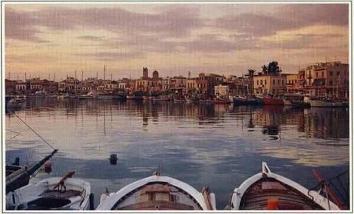 two boats are docked in a body of water at Central Suites Aegina 2 in Aegina Town