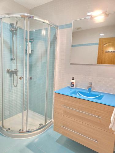 a bathroom with a shower and a sink at Pensión Pedrouzo in O Pedrouzo