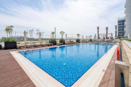 a swimming pool on the roof of a hotel at GuestReady - Urban Retreat in Downtown in Dubai